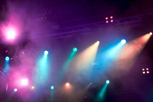 Various blue and pink stage lights in the dark