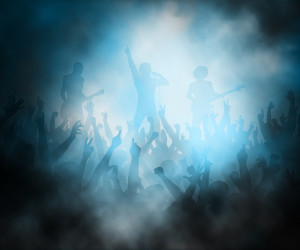 Editable vector illustration of a crowd of people at a rock concert created using gradient meshes