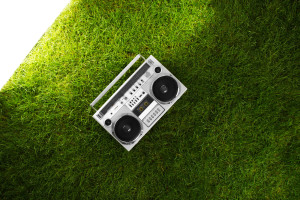 Silver retro blaster over green grass